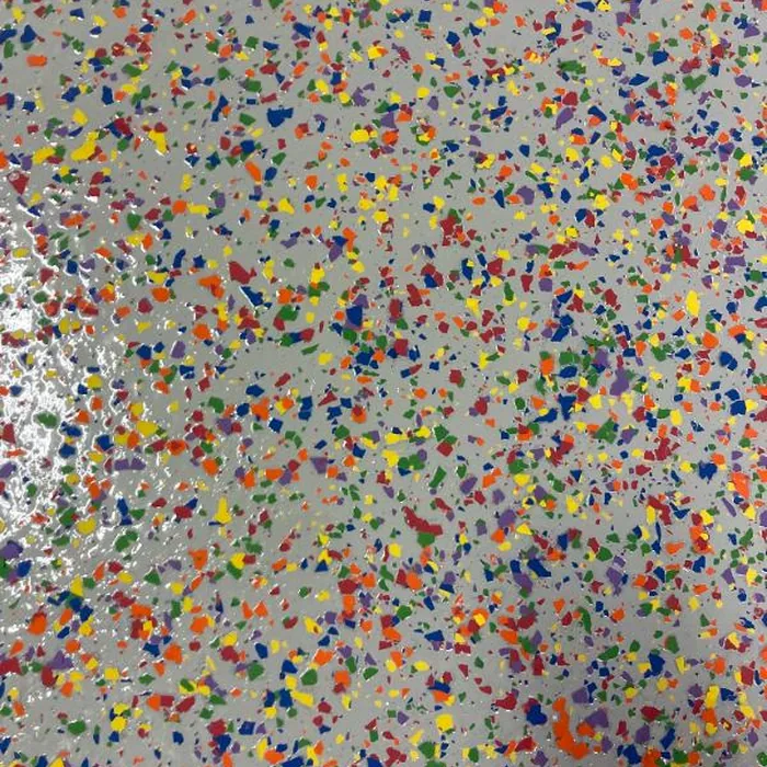 Close-up of multi-color flake broadcast finish